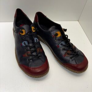 Rieker Liv 61 (L7561) sneakers in navy blue, red, and brown color block